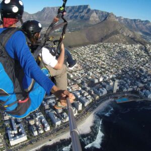 Tandem paragliding over Cape Town with Table Mountain backdrop